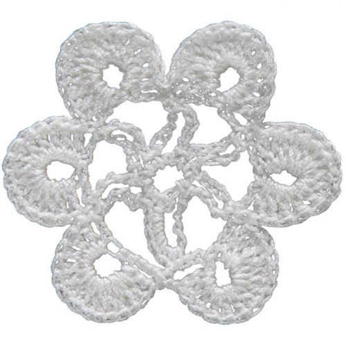 The model is crocheted as a round form. Six leaves around the model and a star motif in the middle are crocheted.