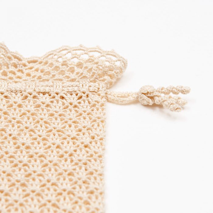 Crochet Eyeglass Pouch With Textured Body Tassel Detail Angle Shot