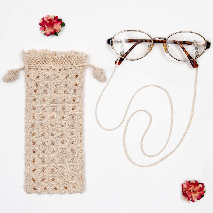 Crochet Soft Drawstring Eyeglass Pouch With Cord Set on The Glass