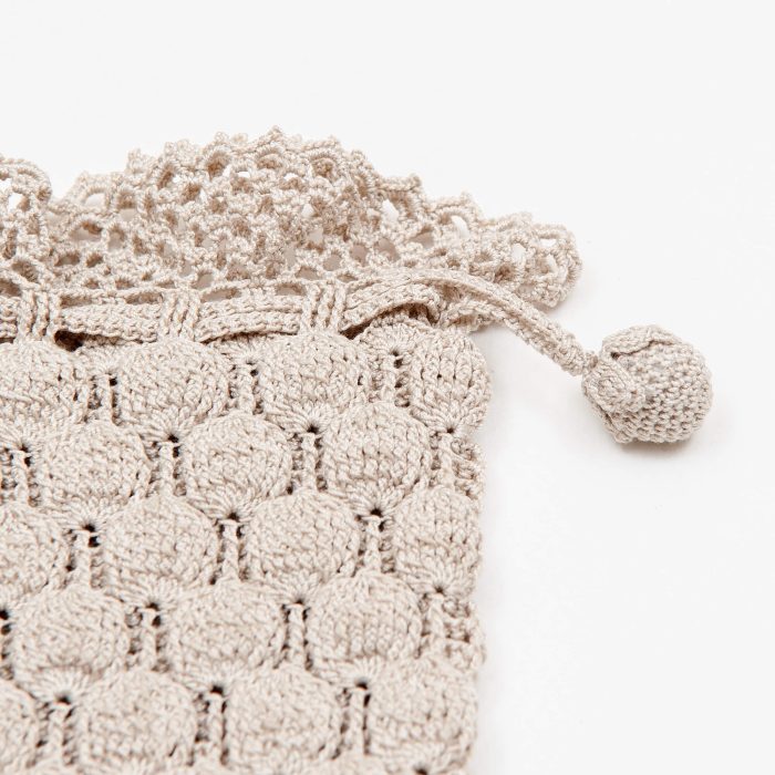 Crochet Case With Embossed Body Tassel Detail Shot