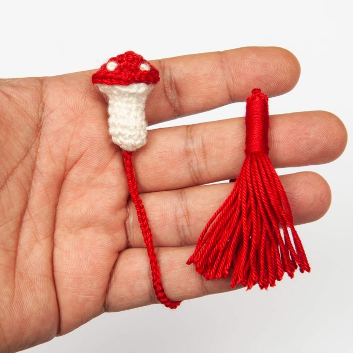Cottagecore-inspired Mushroom Bookmark for Whimsical and Practical Reading Experience Red hand shot