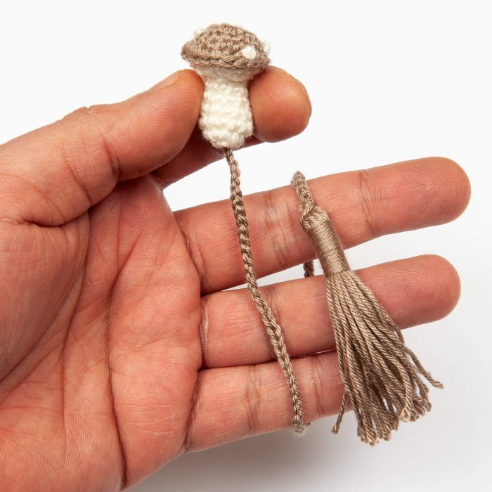 Cottagecore-inspired Mushroom Bookmark for Whimsical and Practical Reading Experience hand Shot