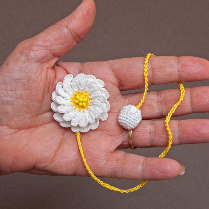 Delicate and Artistic Two-Layered Handmade Micro Crocheted Beaded Daisy Bookmark with Tassel Hand Shot