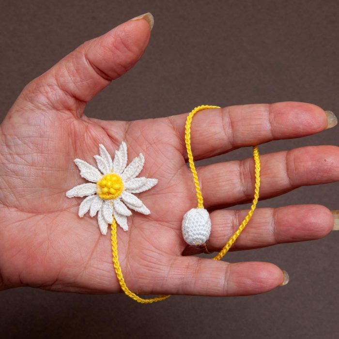 Intricate Two-Layered Handmade Micro Crocheted Beaded Daisy Bookmark with Tassel Hand Shot