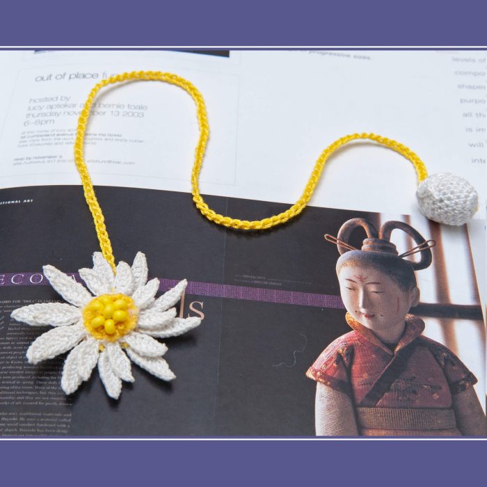 Intricate Two-Layered Handmade Micro Crocheted Beaded Daisy Bookmark with Tassel On Book Shot