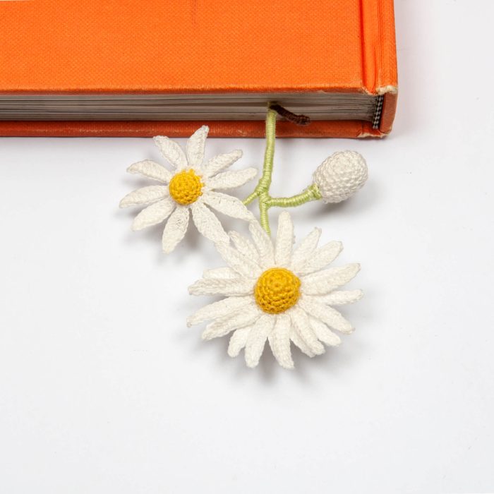 Two White Micro Crochet Handmade Daisy Flower Bookmark On Desk Reverse Close Shot